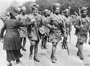 During-a-march-past-of-Indian-troops-a-woman-pins-flowers-on-a-soldiers-tunic_copyright_IWM