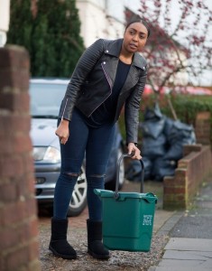 Leah Grey putting out the green food waste bin