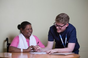 Tom Hutchins, charge nurse at Magnolia ward, with a patient