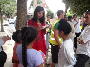 Freida Pinto signing autographs during filming in the borough