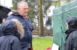 Greg Davies chatting to crew as a scene is prepared