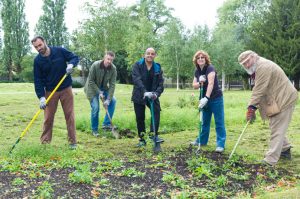 Mani, on the left, with other volunteers during work on the first orchard at Southall Park