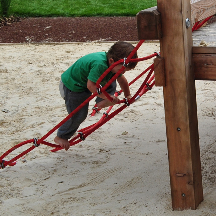 Boy climbing in Walpole Park playground