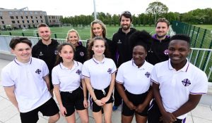 Hayley McQueen with staff and pupils at William Perkin High