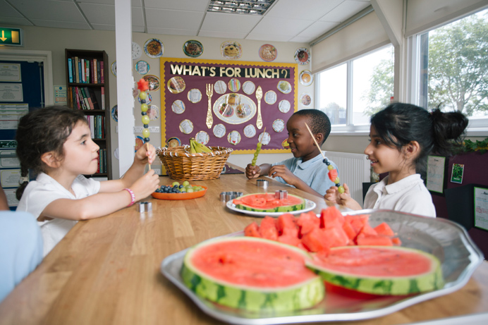 Stanhope Primary School pupils enjoying a healthy snack in the Greenford school's new kitchen