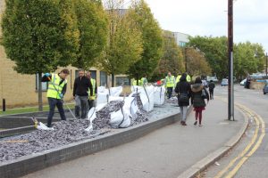 Volunteers applying some of the finishing touches to the new area