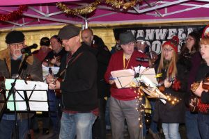 Hanwell Ukelele Group at the Christmas tree light switch on, in Ealing