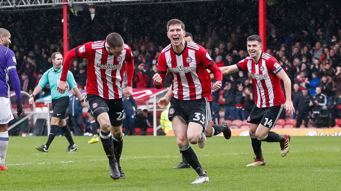 Chris Mepham of Brentford FC celebrates scoring a goal