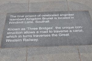 Historical detail on paving slab in St John's Church square, Southall