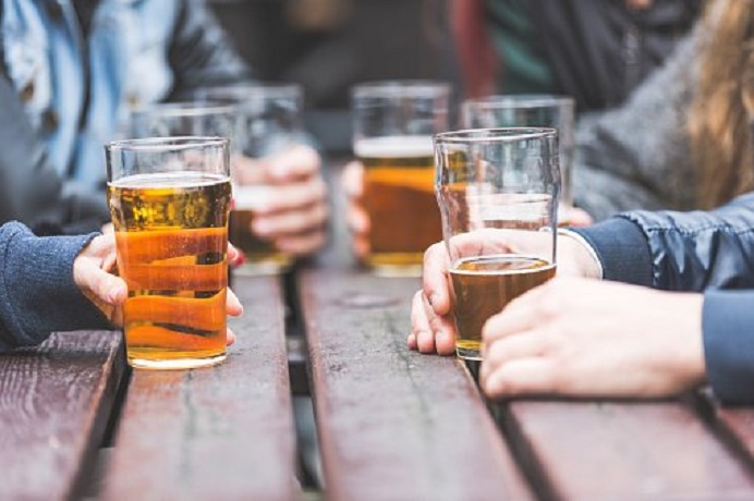 Alcoholic drinks on a pub table outdoors