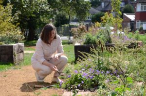 Juliet McDonald, founder of Friends of Friars Gardens, tends plants