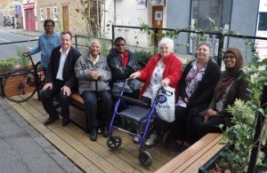 Councillor Julian Bell in a 'parklet' in West Ealing with residents
