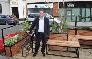 Councillor Julian Bell in a 'parklet' with his bike