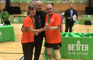 Ealing's short tennis champs Pamela and Eddie receiving their trophy