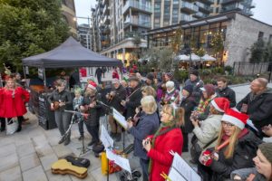 Ukelele band and choir at Christmas lights switch on in Dickens Yard, Ealing