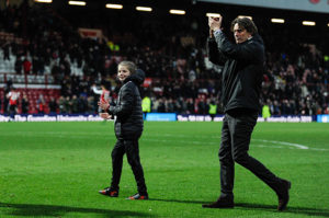 Young coach for the day Eira with manager Thomas Frank after Brentford v Blackburn Rovers