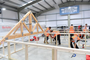 Learning to construct timber frames for roofs, at the construction academy