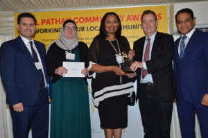 Ealing Council leader Julian Bell hands PESTS project manager Joy Barton the award at the ceremony at the House of Commons