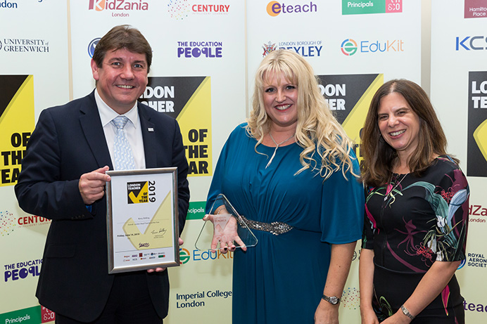 Headteacher of the year Kerry Shilling (centre) with Stephen Metcalfe MP and Rosalind Azouzi of ceremony hosts the Royal Aeronautical-Society