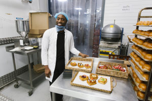 Andy Gittens, sales manager, with some of the patisserie goods at Debaere bakery and patisserie in Perivale