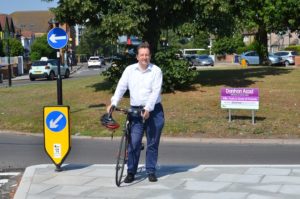 Councillor Julian Bell road testing the new round about