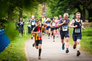 Runners at the Ealing Mile in Lammas Park