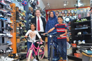 Leader of Ealing Council, Julian Bell, handed over new bikes to Maryan and Yahya. Pictured here with their mum Tasneem.