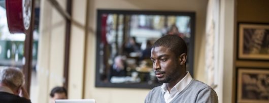 New online account. Man working on laptop