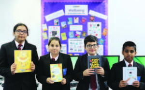 Featherstone High School's wellbeing award: Year 7 pupils enjoying a selection of wellbeing books in the school library