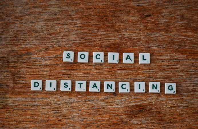 Social distancing written in Scrabble type tiles