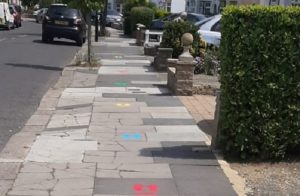 Colourful markings on the pavement to encourage children to walk to school