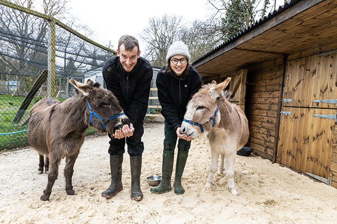 Hanwell Zoo keepers Annie and Dave with mini donkeys