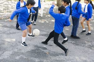 St Anselm's Primary School pupils enjoying football - sports participation has increased hugely