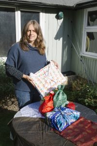 Mary Horesh with alternative, reusable Christmas wrapping for presents