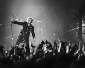 David Bowie performing - photo by Roger Woolman, via Wikimedia Commons