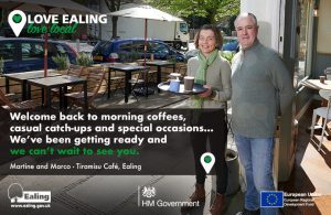 Cafe owners serving outside tables