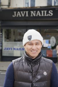 Van Dao owner of Javi Nails outside his business