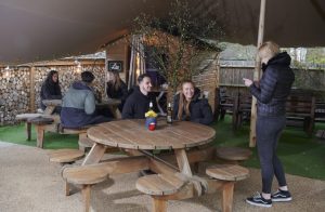 Customers return to the Plough pub, Norwood Green