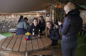 Customers enjoying the new outdoor garden at the Plough Pub, Norwood Green