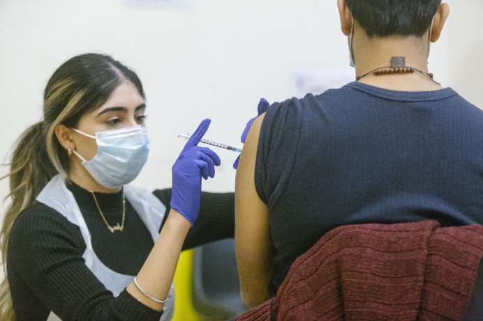 Nurse administering COVID-19 vaccine