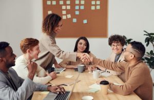 Group of adults sharing ideas across a table