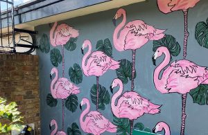 Pink flamingo mural painting on a wall at Hanwell Zoo