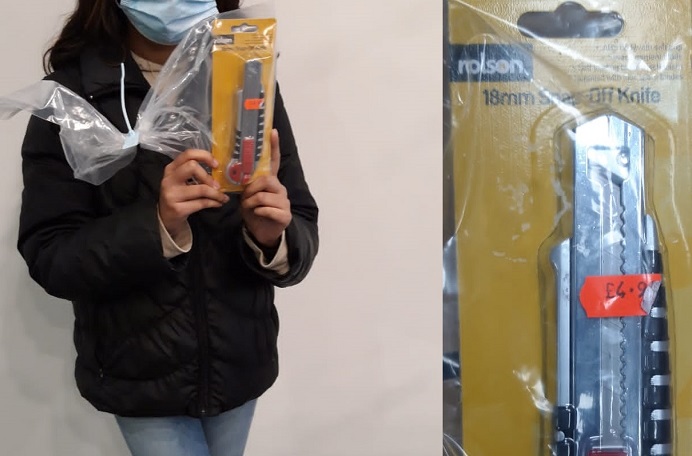 Anonymous girl with knife and knife in packaging