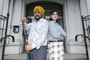 Man and woman standing on the steps of Southall Town Hall