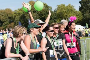 Group of women runners celebrating after finishing the Ealing Half Marathon