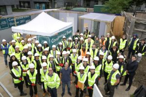 Cllr Mahfouz surrounded by construction students at a workshop event