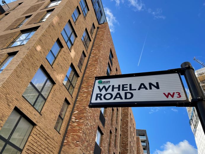 Street sign showing Whelan Road in Acton Gardens