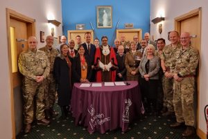 Group picture of military personnel and Ealing Council