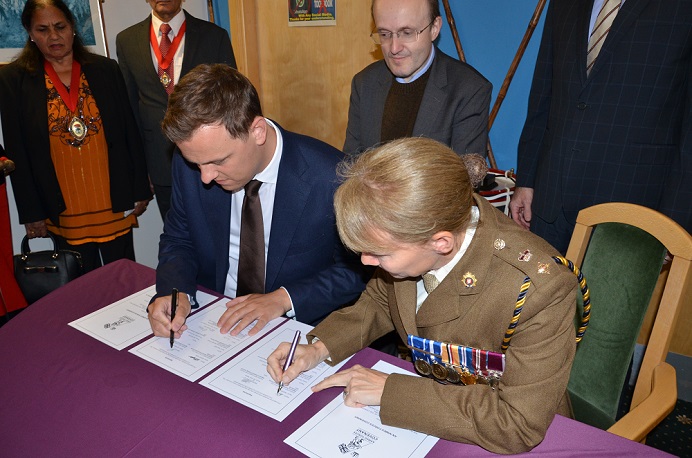 Cllr Peter Mason, Leader of Ealing Council and Lt Col Deborah Taylor signing the Armed Forces Covenant