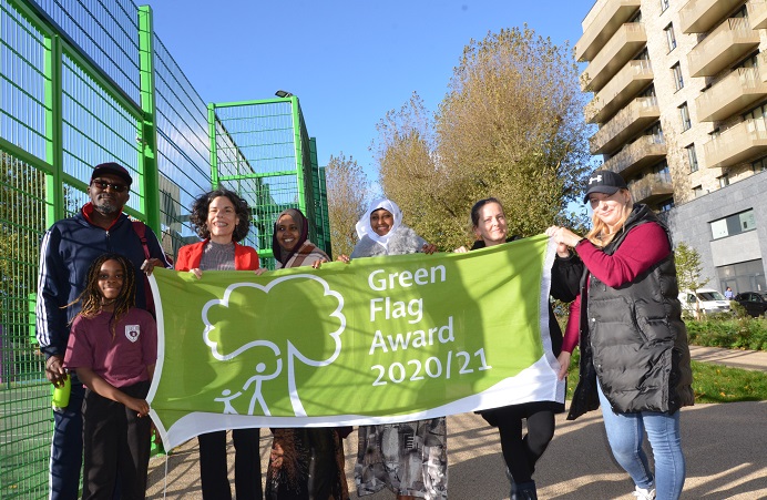 Councillor Costigan and residents with a green flag